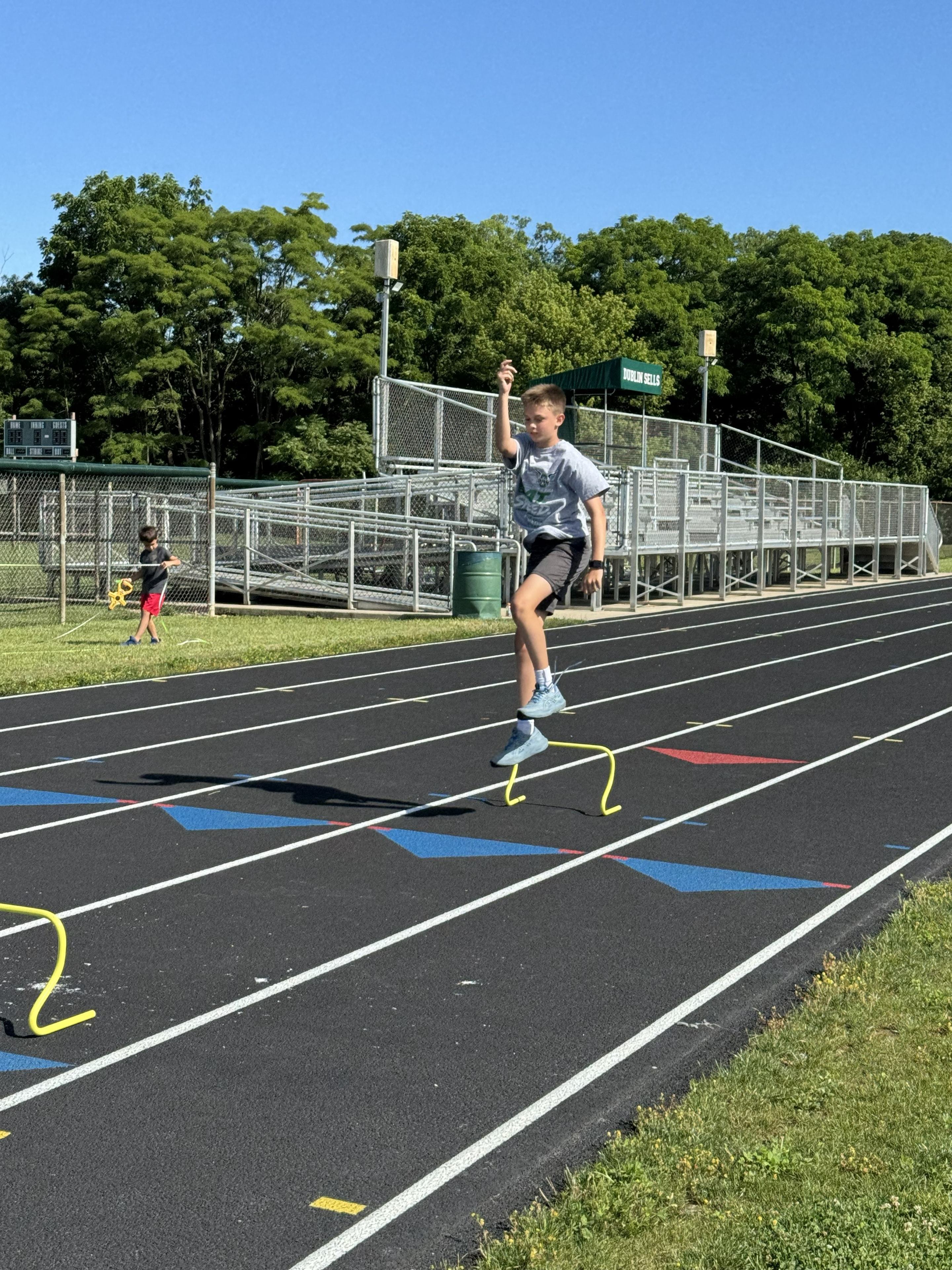 Young athlete working through agility drills on the track