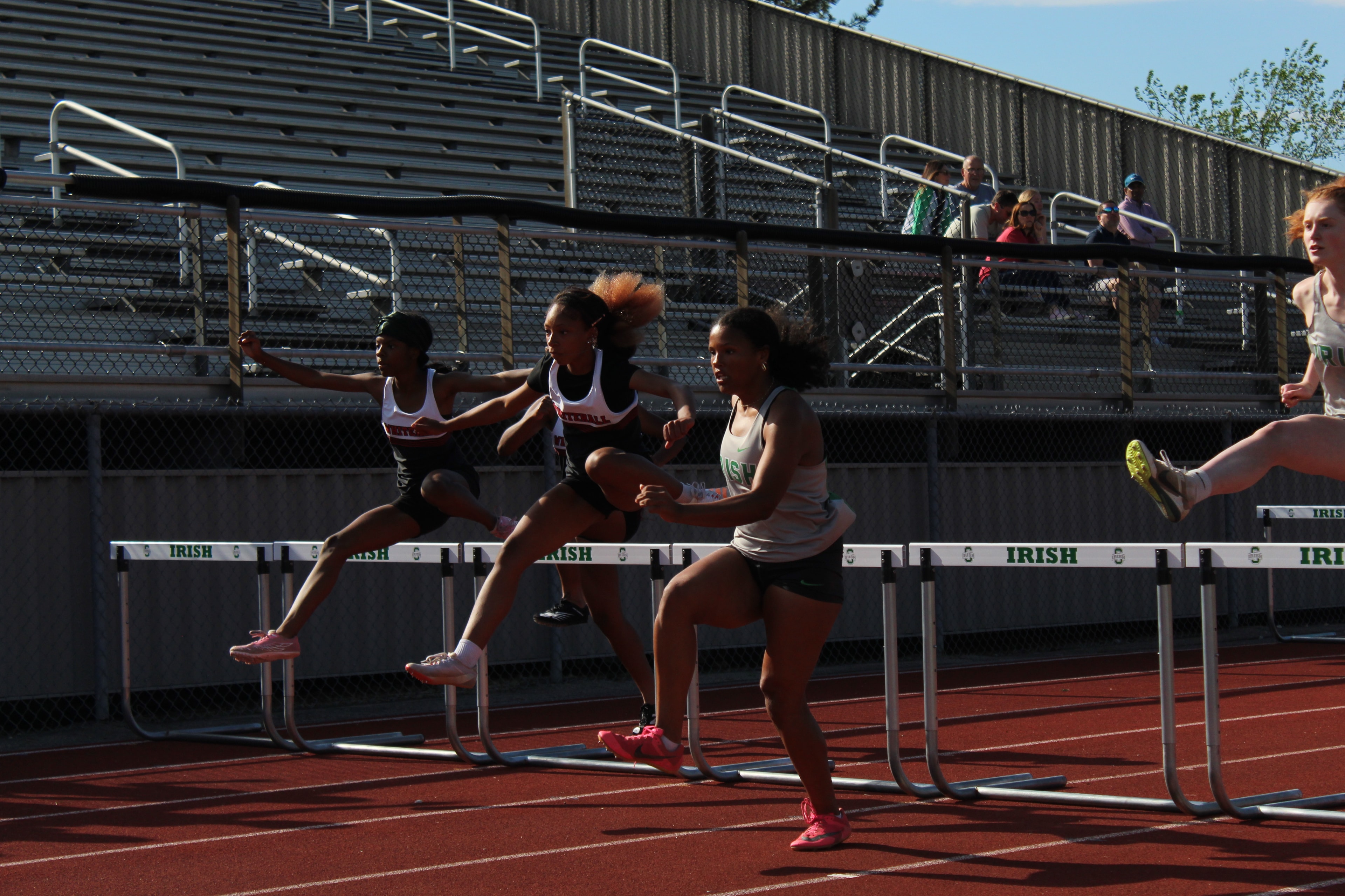 Irish girls clearing hurdles in competition