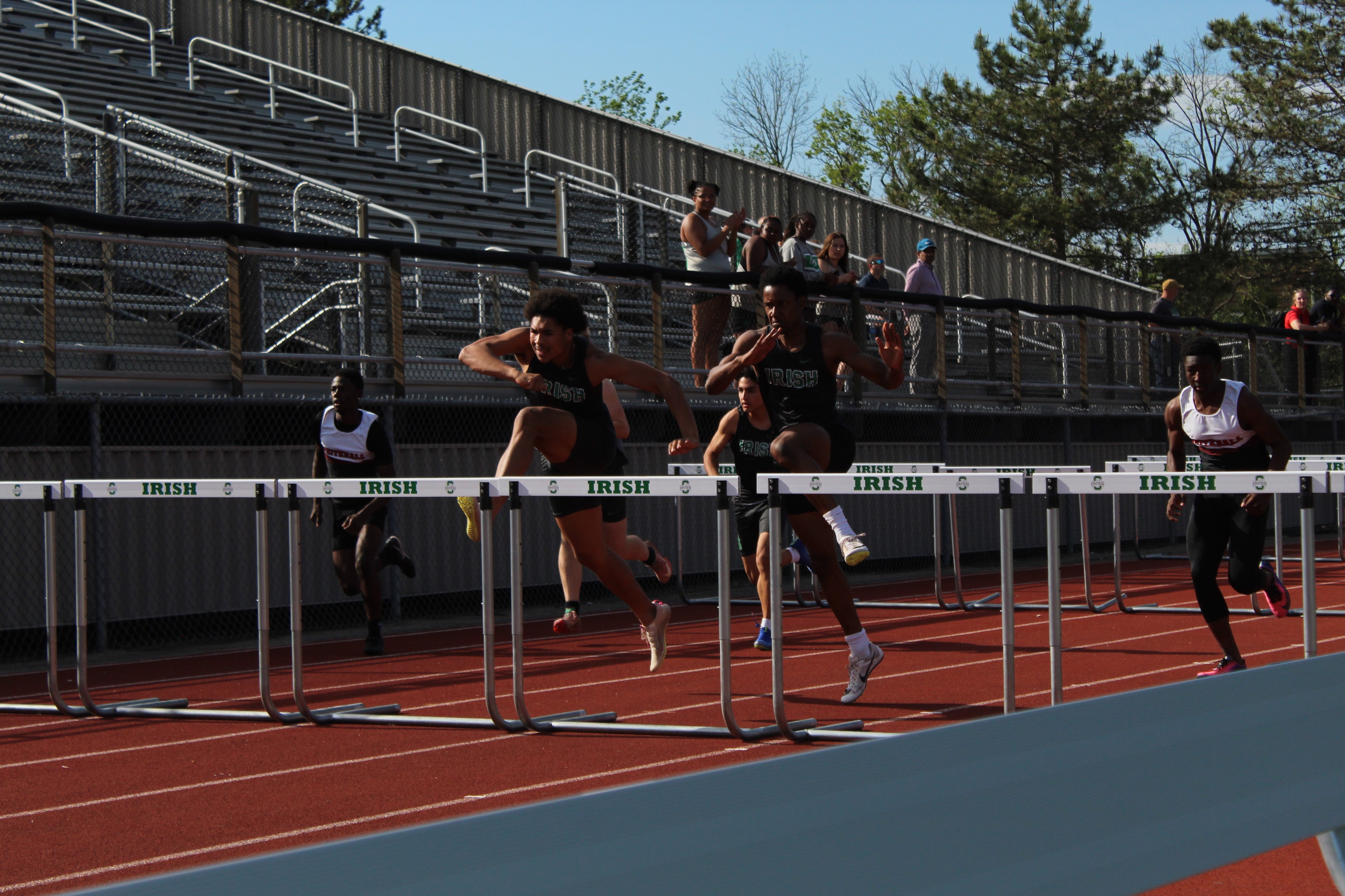 Irish boys clearing hurdles in competition