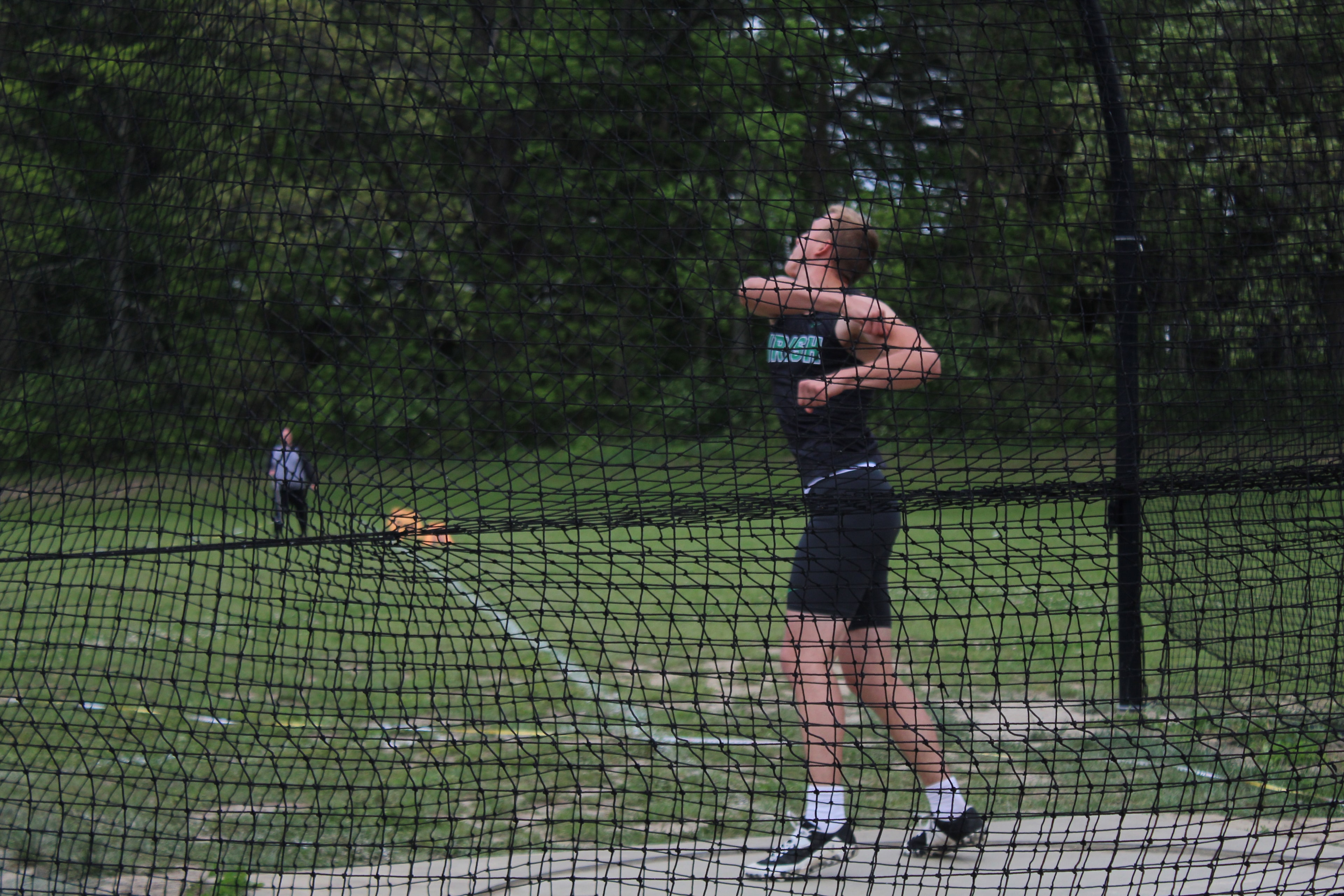 Irish athlete throwing discus in competition