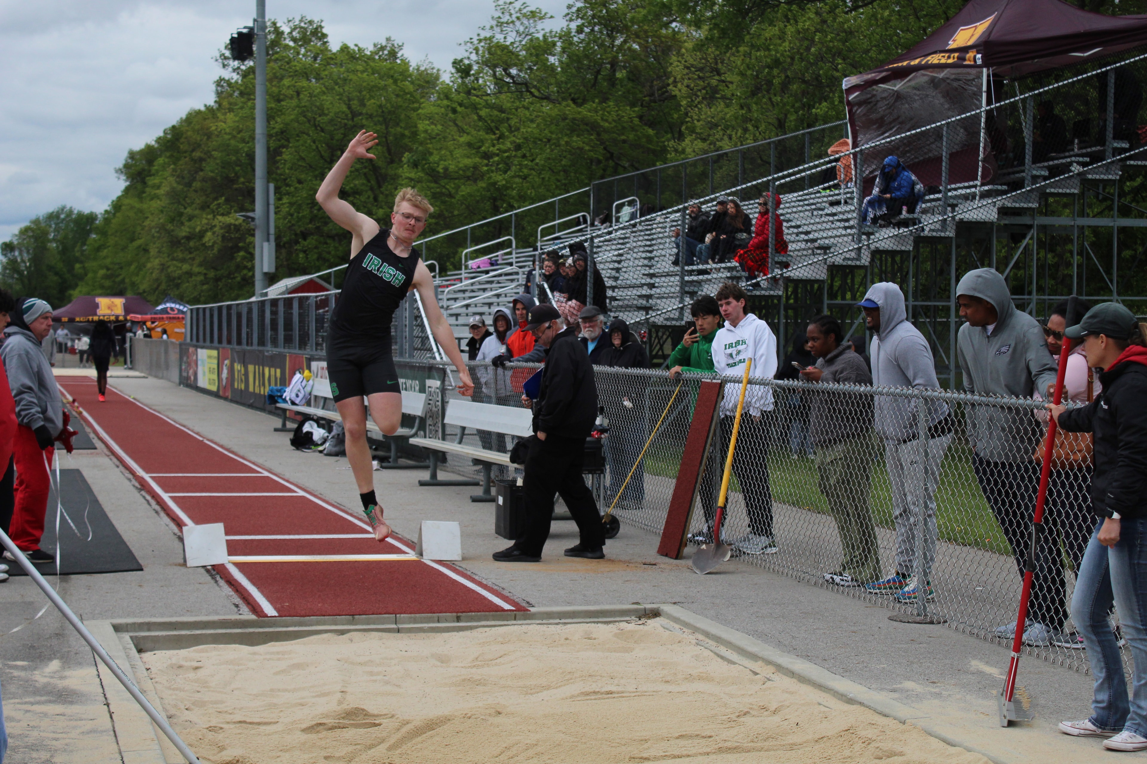 Irish athlete soaring in the long jump