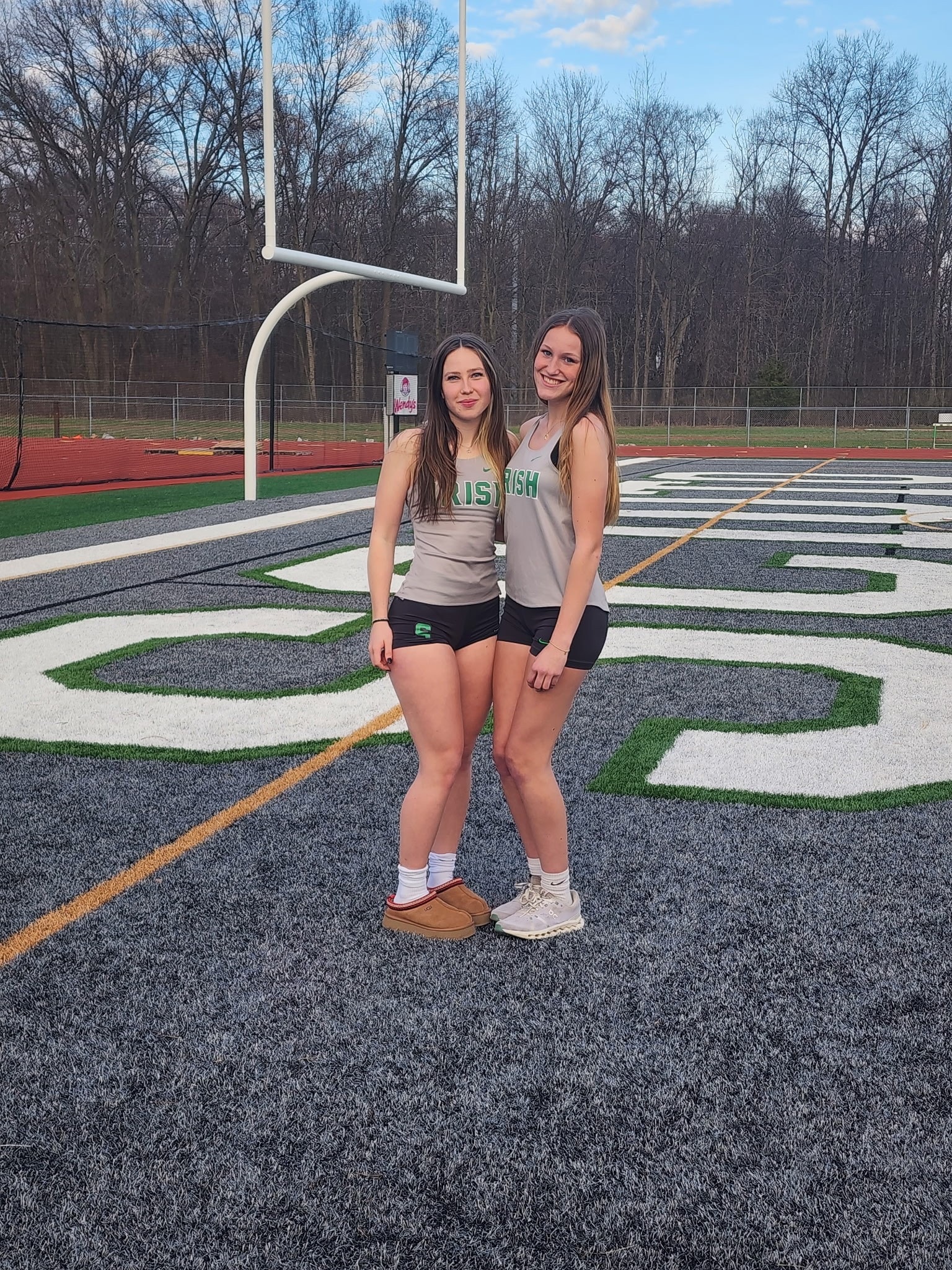 Two Irish athletes on the field